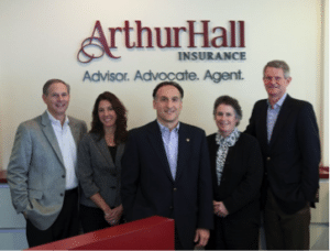 Management team at Arthur Hall with the updated reception signage with dimensional letters