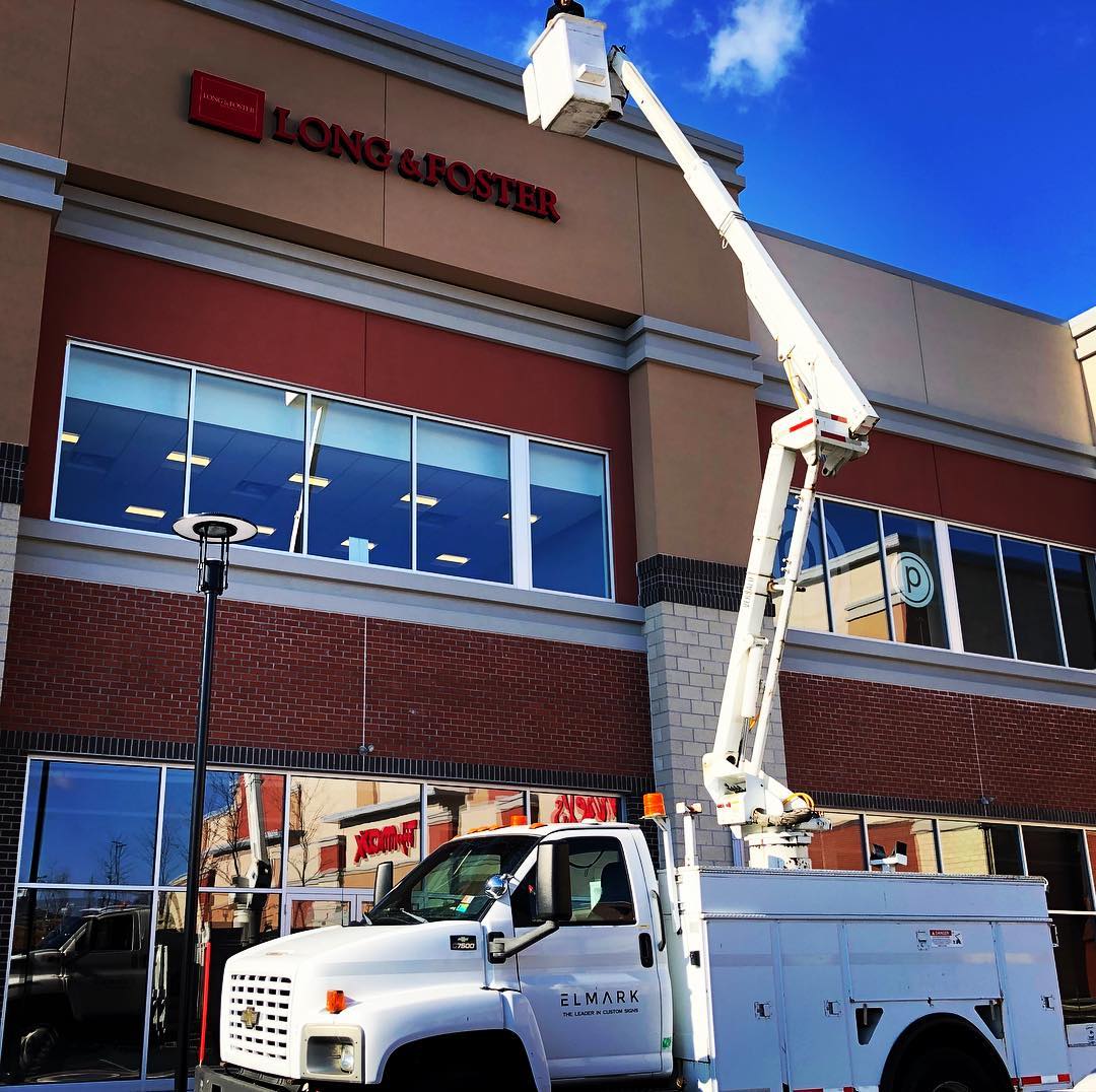 sign installation with bucket truck